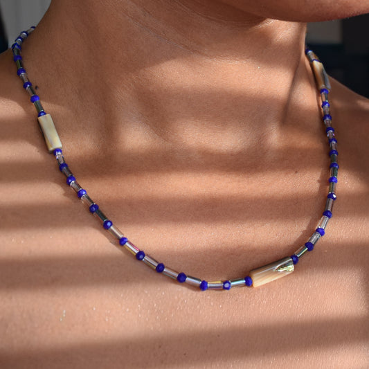 Handcrafted necklace with shell and glass beads for elegant, refined style by Ayiti Chérie. Haitian-inspired, lifestyle brand