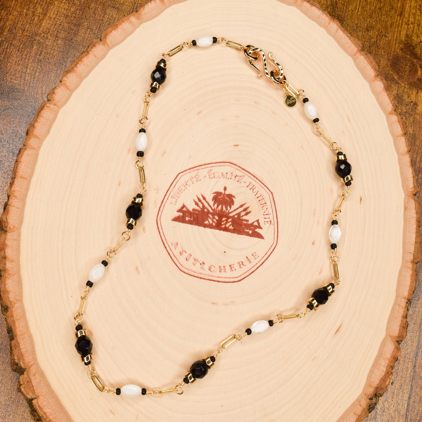 Handcrafted necklace- Mother-of-Pearl, hematite, & glass beads for refined, modern elegance. Haitian-inspired, lifestyle brand