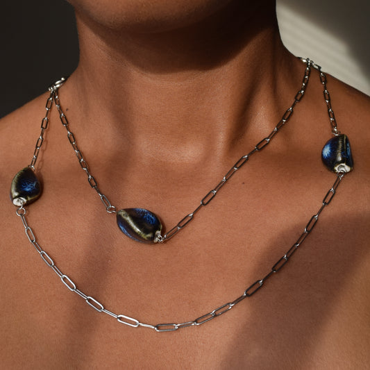 Handcrafted with silver paper-clip chain featuring twisted oval ceramic beads for elegant, refined style by Ayiti Chérie. Haitian-inspired, lifestyle brand