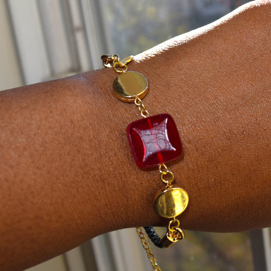 Handcrafted bracelet- Mosaic glass metal disc beads, and braided leather for refined, modern elegance. Haitian-inspired, lifestyle brand