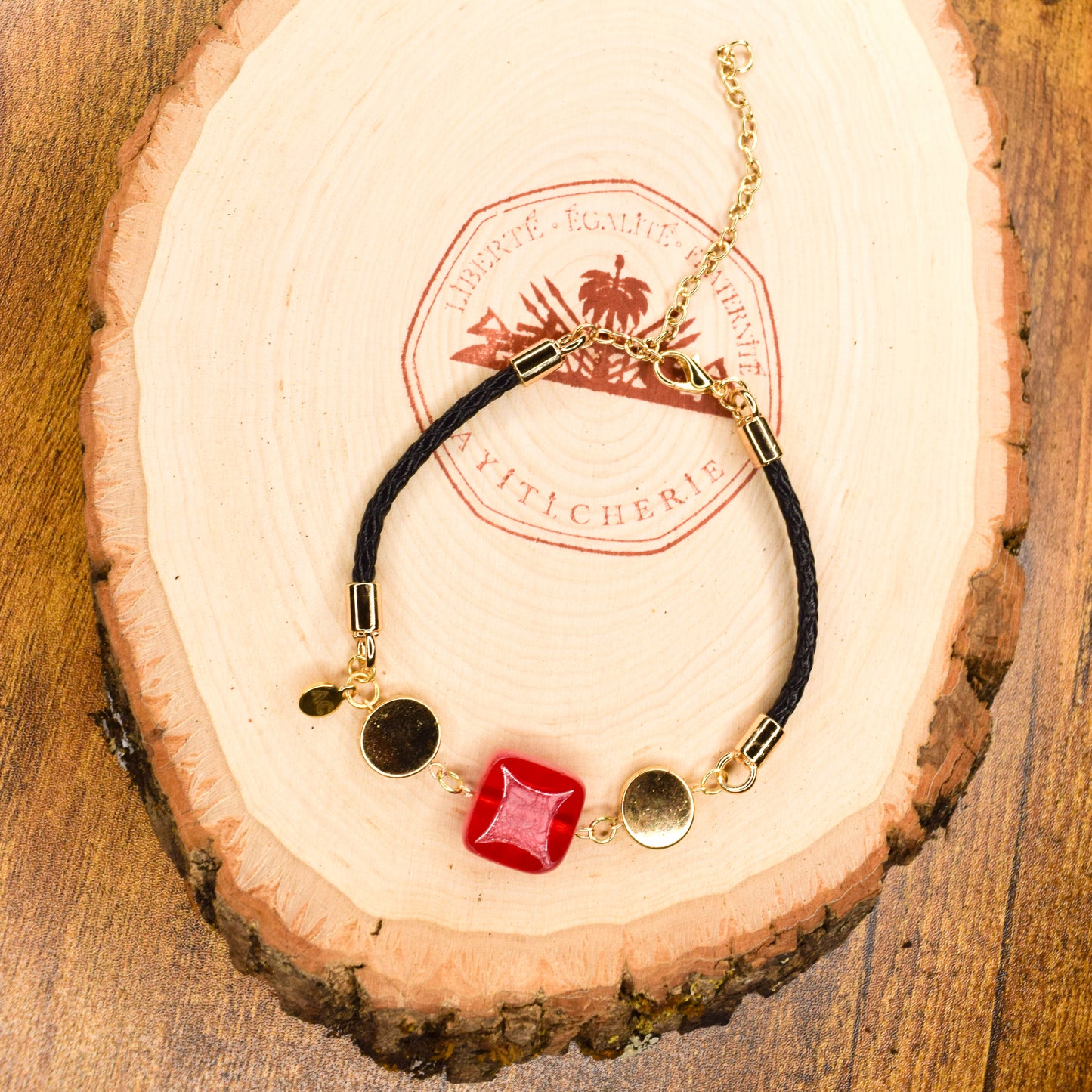 Handcrafted bracelet- Mosaic glass metal disc beads, and braided leather for refined, modern elegance. Haitian-inspired, lifestyle brand