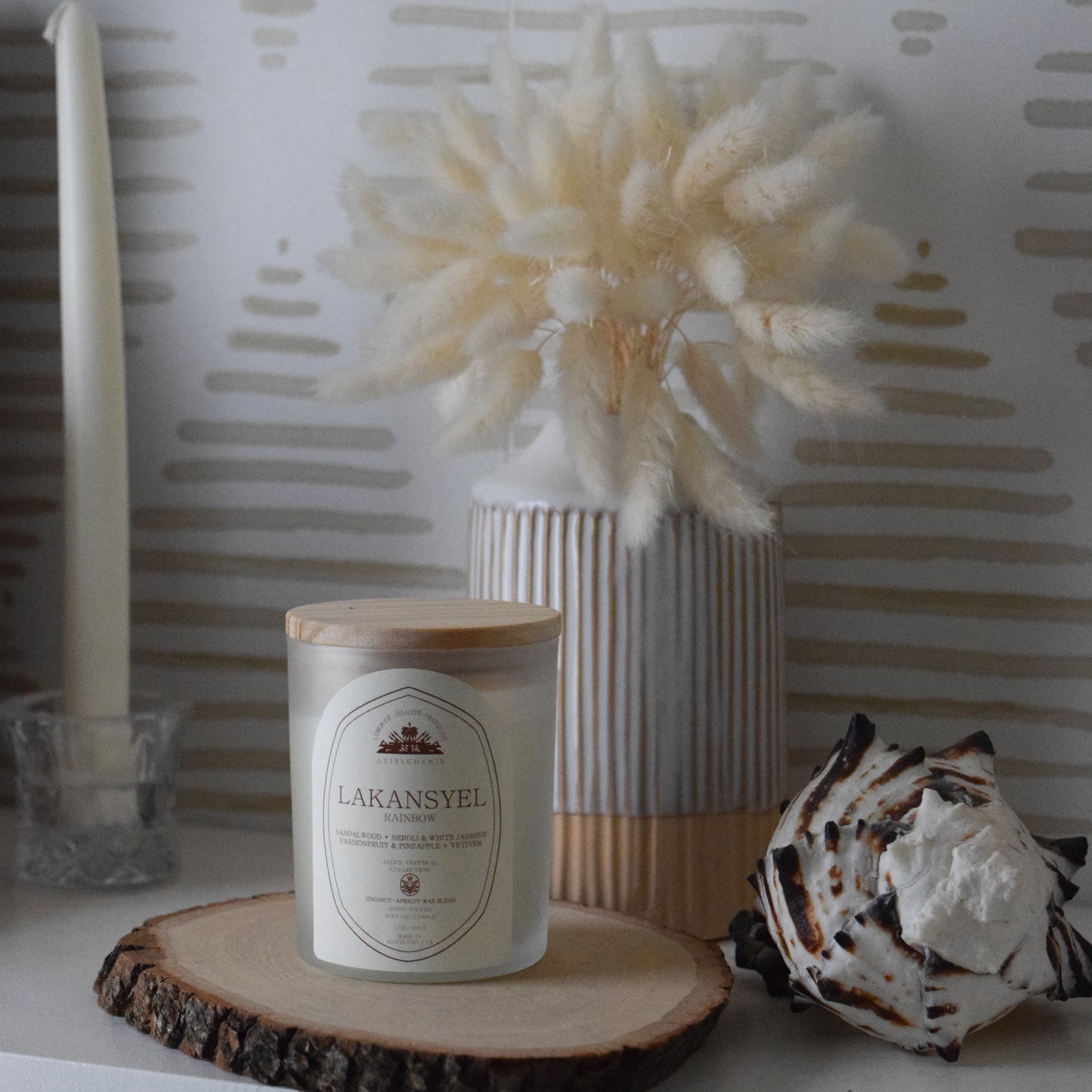 Rainbow candle with passionfruit and pineapple, neroli and white jasmine, sandalwood, and vetiver by Ayiti Cherie