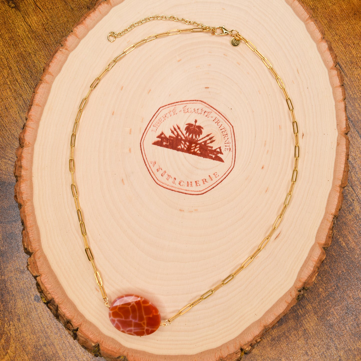 Handcrafted with 18K gold-plated paper clip chain, featuring fire agate stone for elegant & refined style by Ayiti Chérie. Haitian-inspired, lifestyle brand