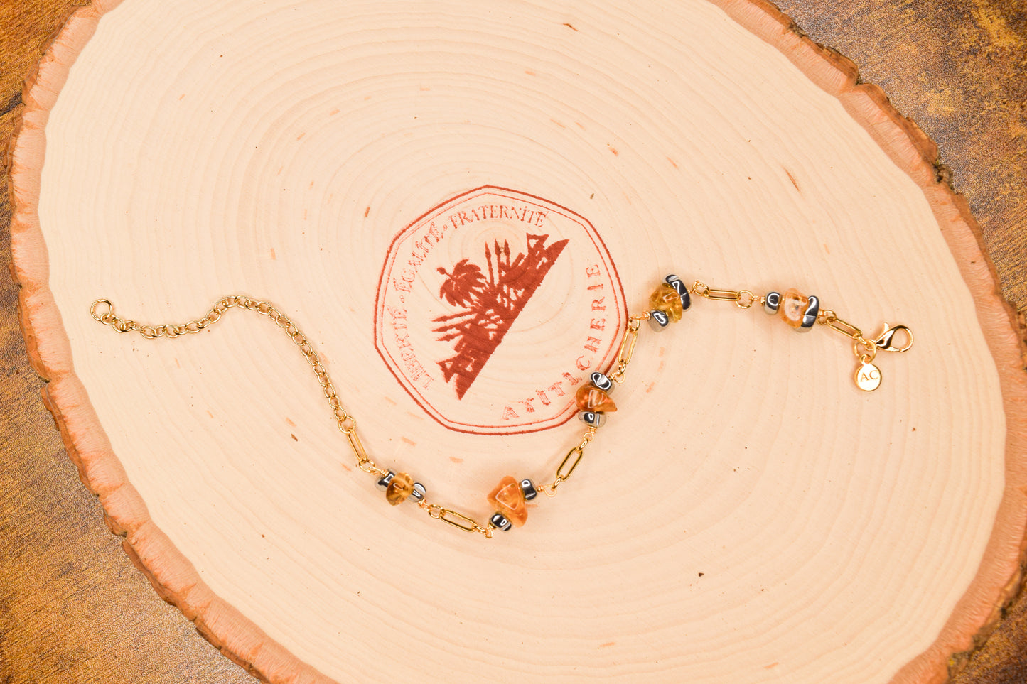 Handcrafted with 18K gold-plated paperclip chain, featuring citrine and hematite for elegant, refined style by Ayiti Chérie. Haitian-inspired, lifestyle brand