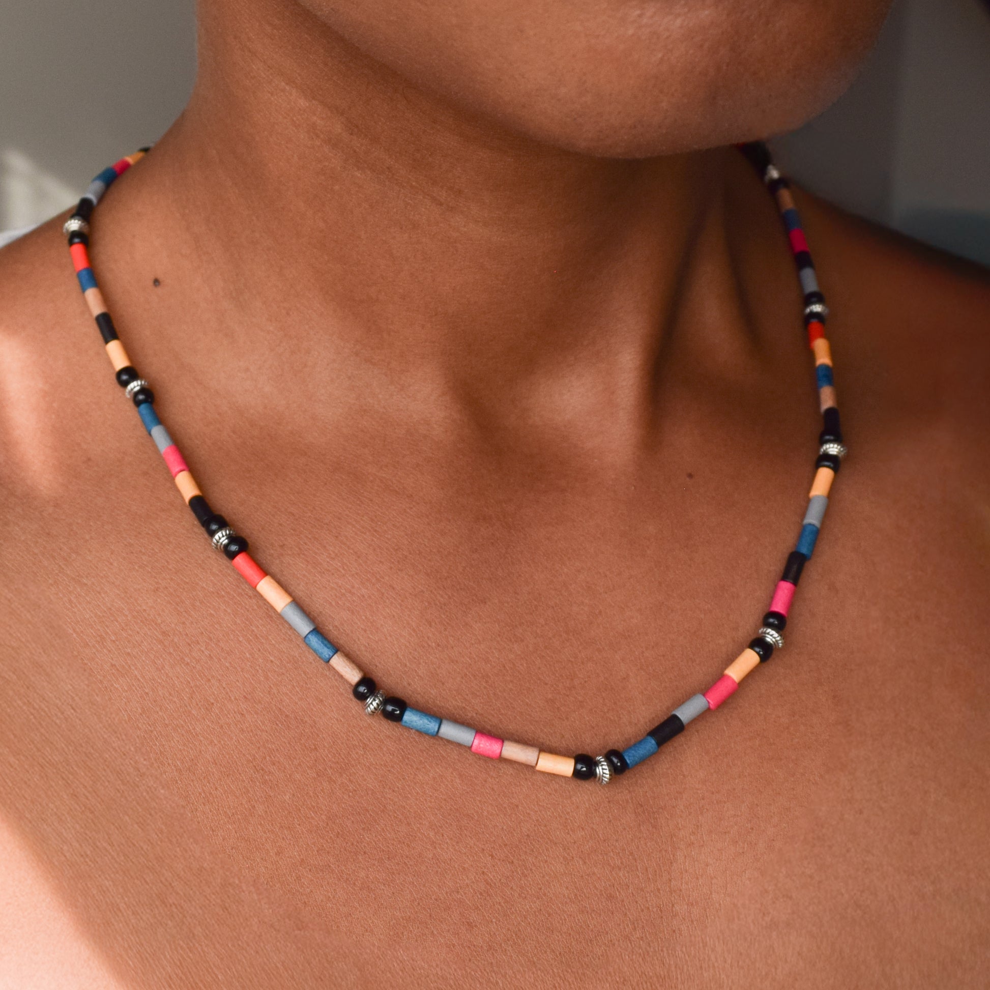 Handcrafted necklace- Painted wooden & carved metal beads for refined, modern elegance. Haitian-inspired, lifestyle brand