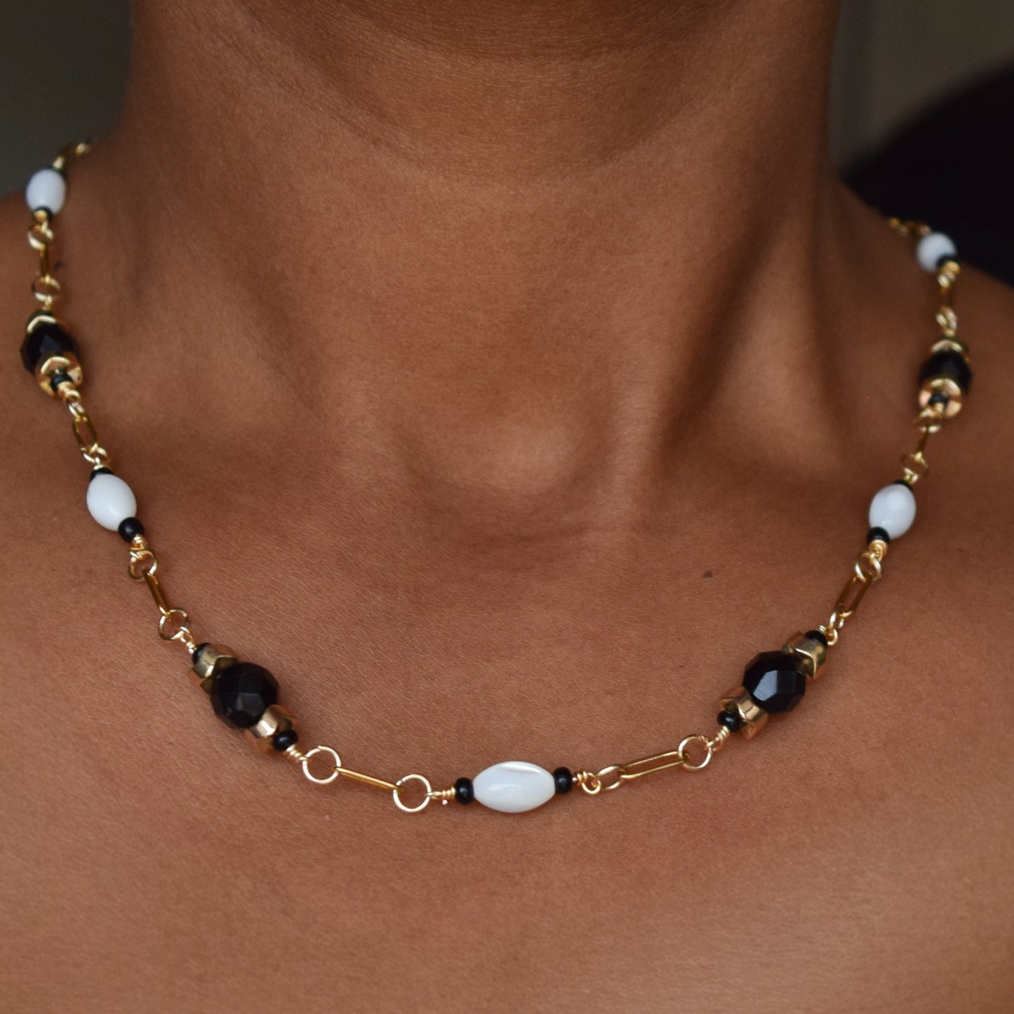 Handcrafted necklace- Mother-of-Pearl, hematite, & glass beads for refined, modern elegance. Haitian-inspired, lifestyle brand