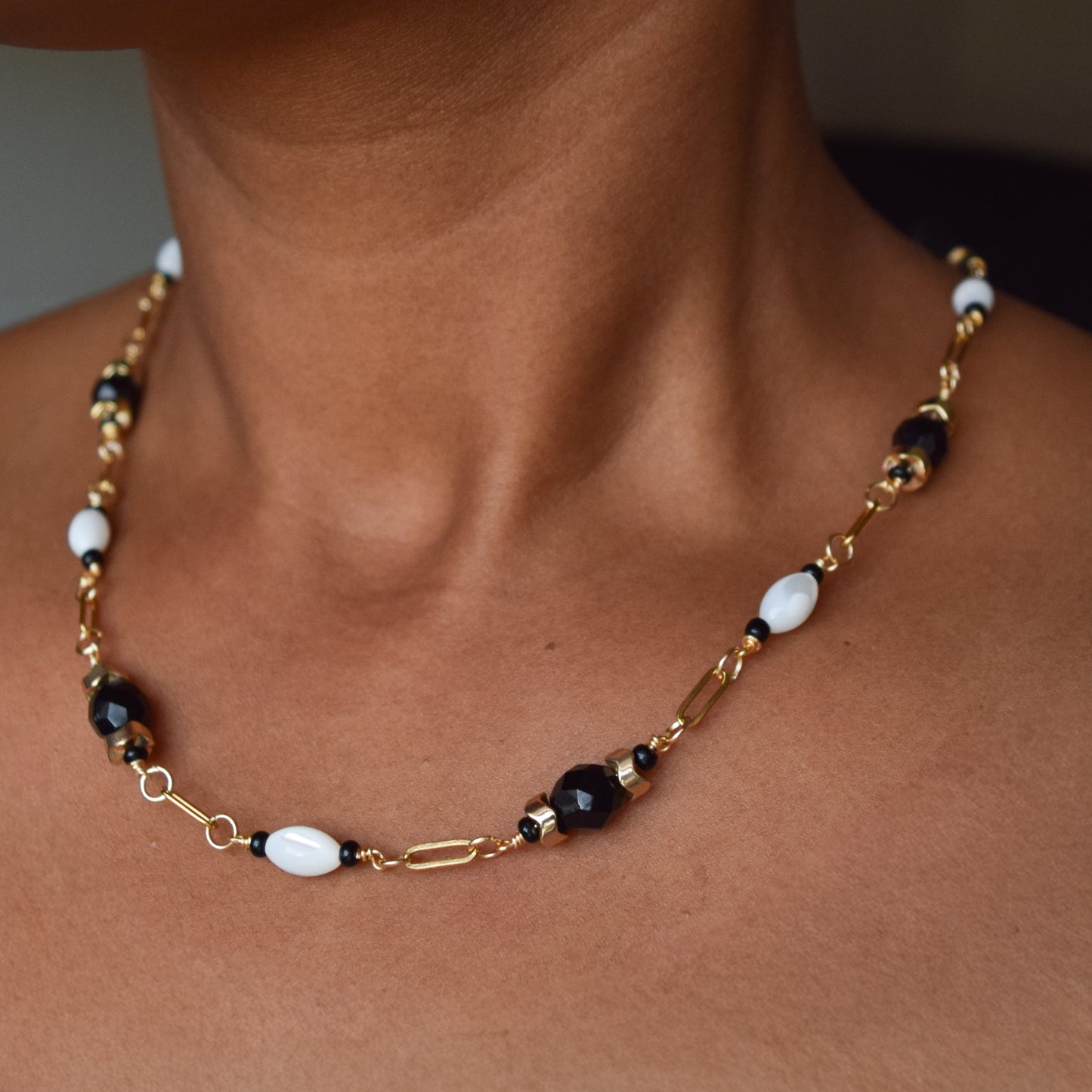 Handcrafted necklace- Mother-of-Pearl, hematite, & glass beads for refined, modern elegance. Haitian-inspired, lifestyle brand