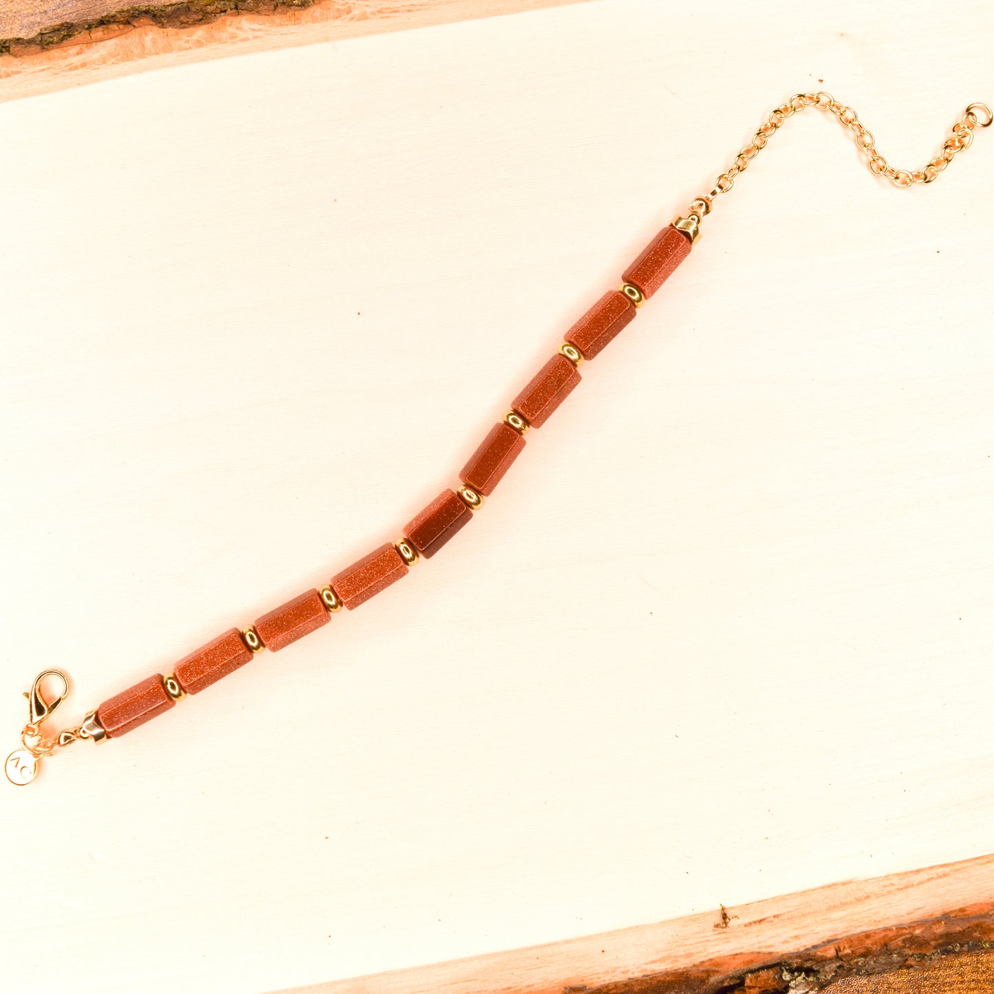 Handcrafted with goldstone & metal beads for elegant, refined style by Ayiti Chérie. Haitian-inspired, lifestyle brand