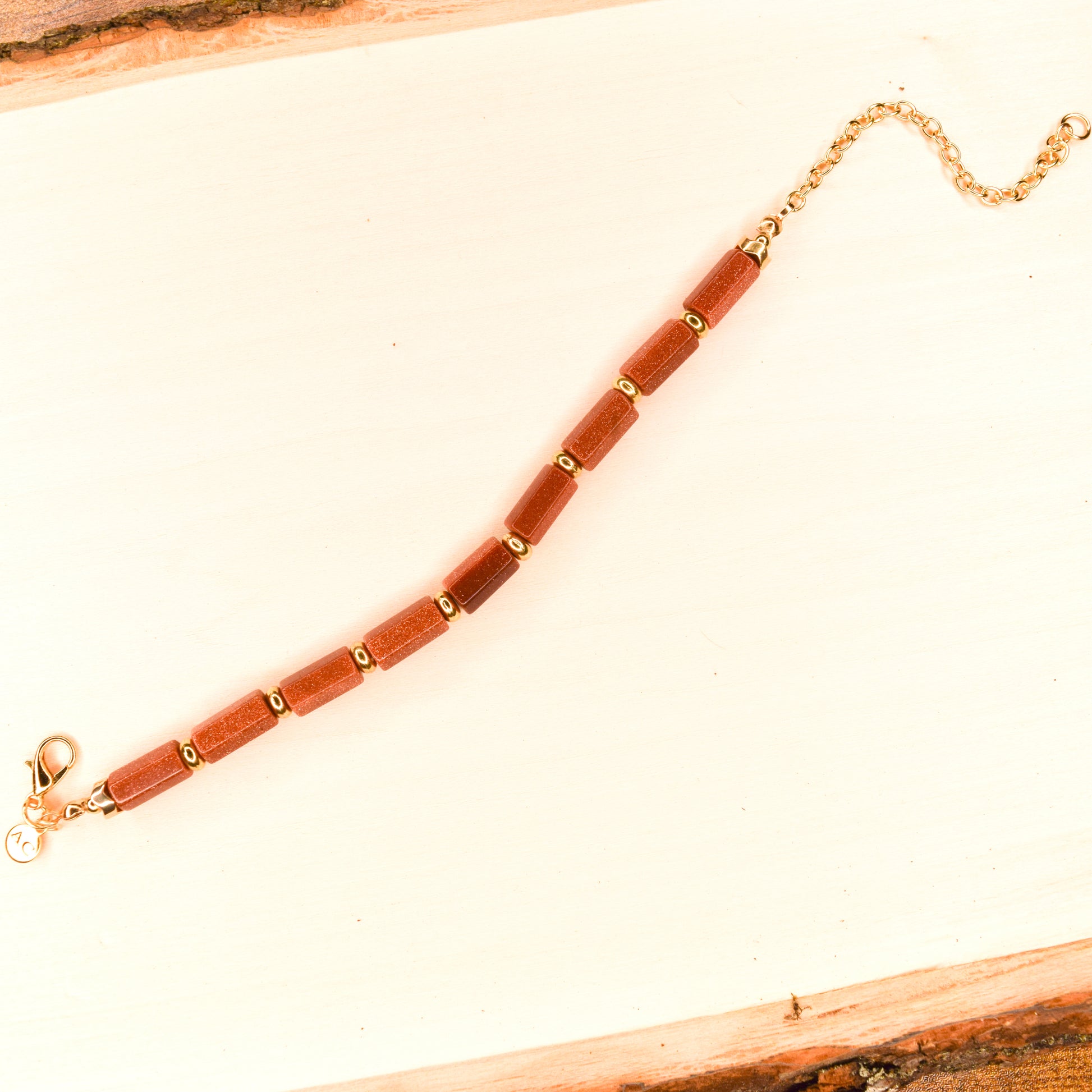 Handcrafted with goldstone & metal beads for elegant, refined style by Ayiti Chérie. Haitian-inspired, lifestyle brand