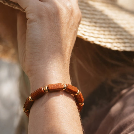 Handcrafted with goldstone & metal beads for elegant, refined style by Ayiti Chérie. Haitian-inspired, lifestyle brand