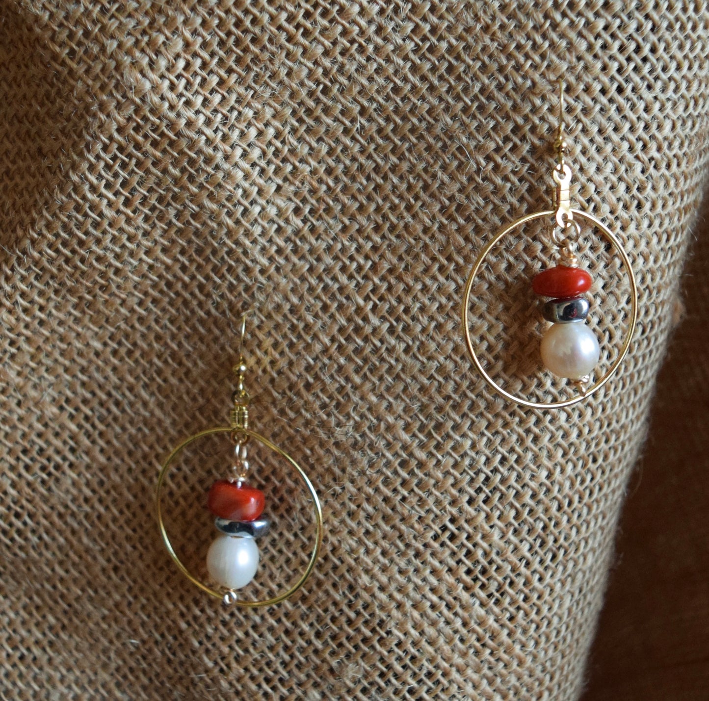 Handcrafted earrings with hematite, coral, and potatoe pearl beads for elegant, refined style by Ayiti Chérie. Haitian-inspired, lifestyle brand