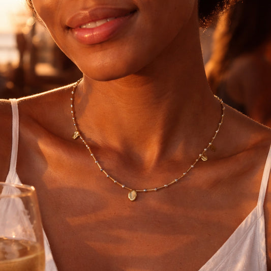 Handcrafted necklace with plated pyrite and pearl beads for elegant, refined style by Ayiti Chérie. Haitian-inspired, lifestyle brand