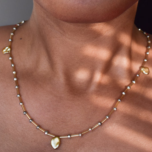 Handcrafted necklace with plated pyrite and pearl beads for elegant, refined style by Ayiti Chérie. Haitian-inspired, lifestyle brand