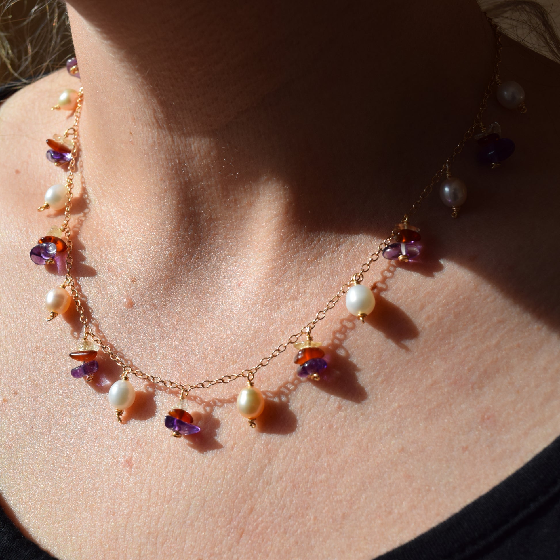 Handcrafted with delicate curb chain, featuring pearls, amethyst, & citrine for elegant, refined style by Ayiti Chérie. Haitian-inspired, lifestyle brand