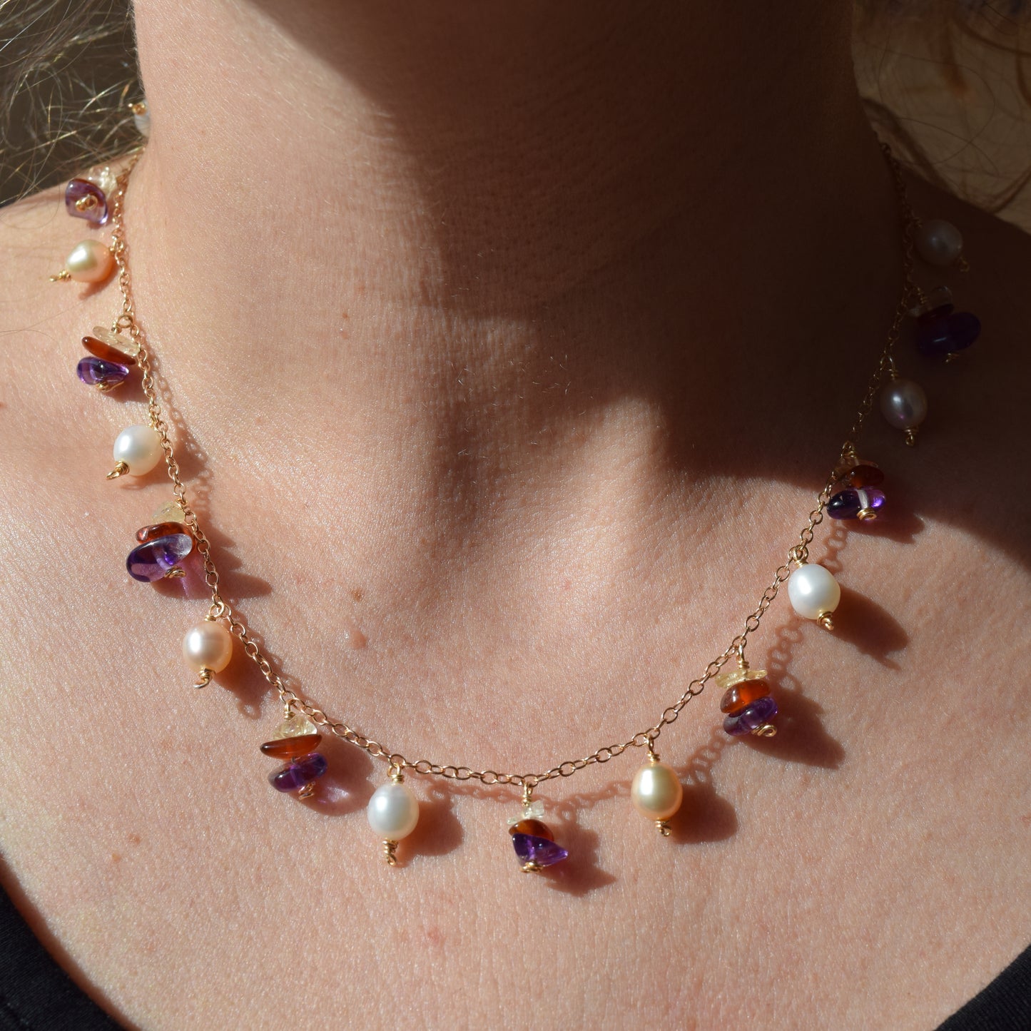 Handcrafted with delicate curb chain, featuring pearls, amethyst, & citrine for elegant, refined style by Ayiti Chérie. Haitian-inspired, lifestyle brand