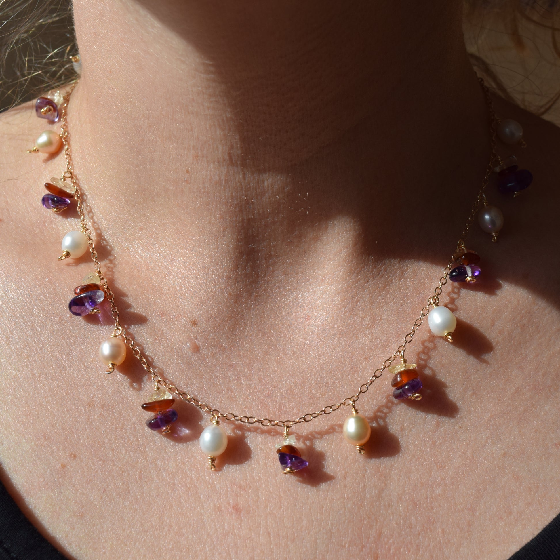 Handcrafted with delicate curb chain, featuring pearls, amethyst, & citrine for elegant, refined style by Ayiti Chérie. Haitian-inspired, lifestyle brand
