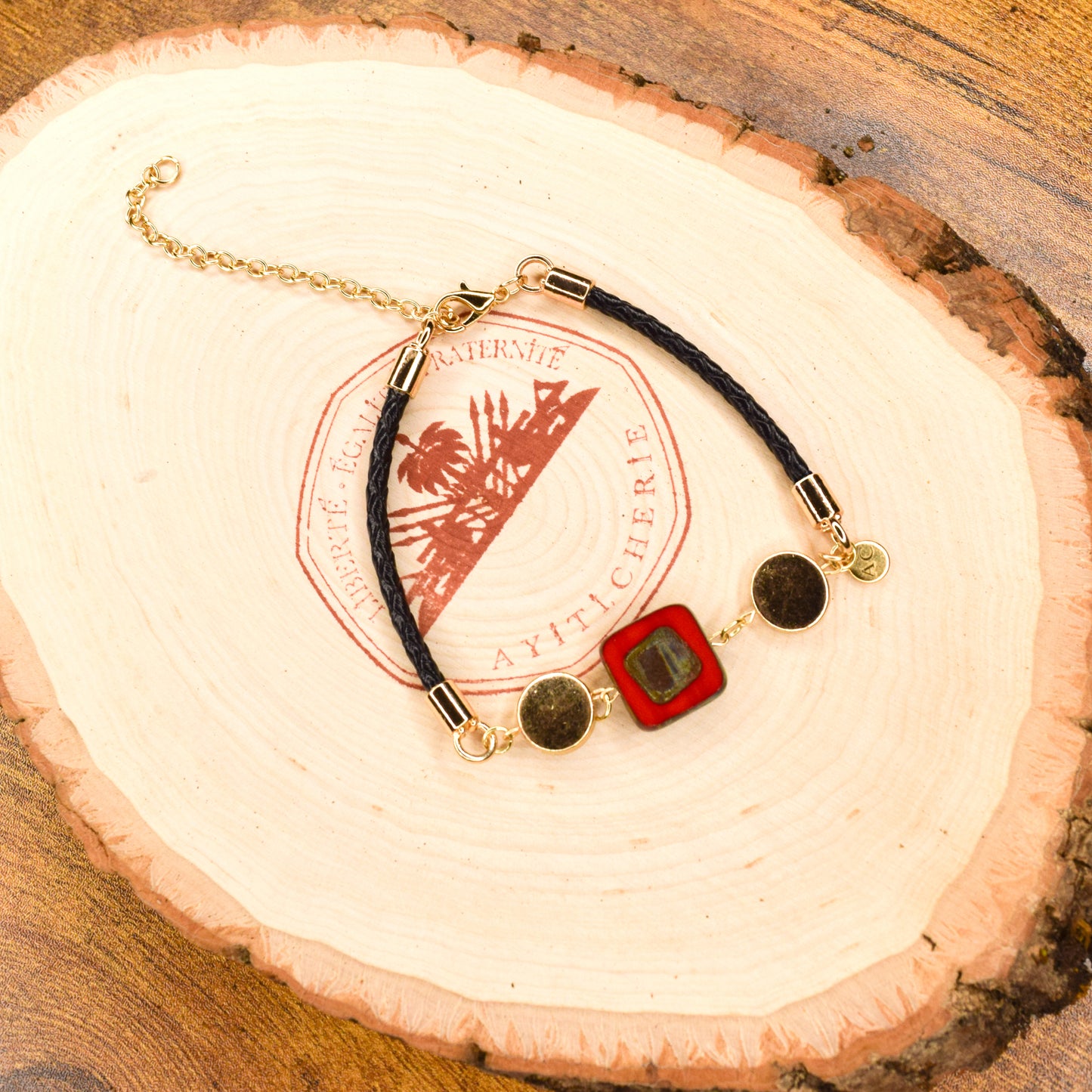 Handcrafted bracelet- Mosaic glass metal disc beads, and braided leather for refined, modern elegance. Haitian-inspired, lifestyle brand