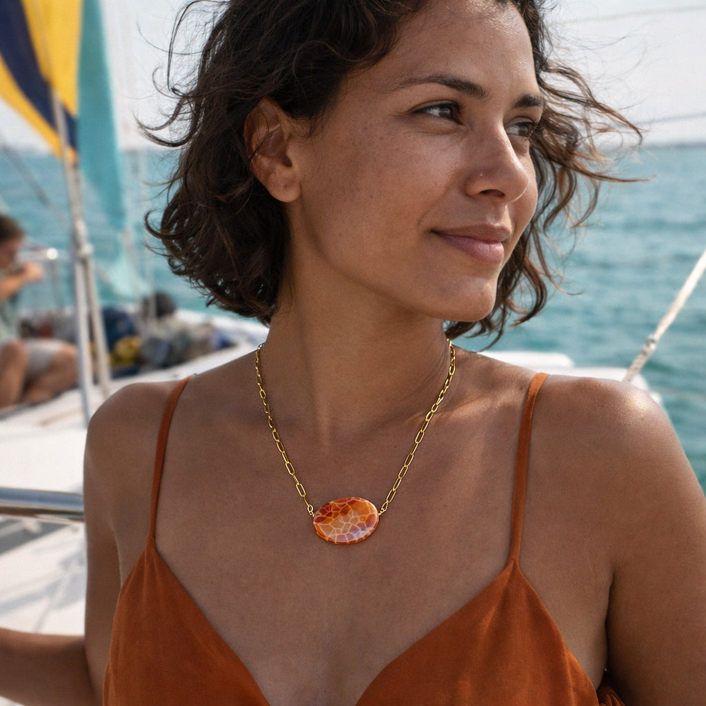 Handcrafted with 18K gold-plated paper clip chain, featuring fire agate stone for elegant & refined style by Ayiti Chérie. Haitian-inspired, lifestyle brand