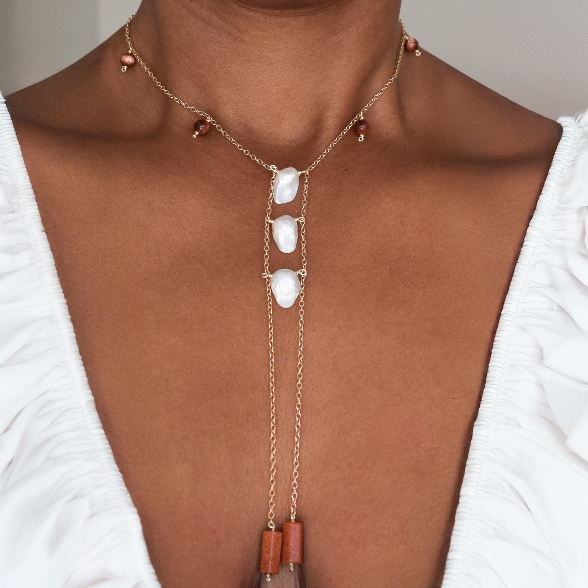 Handcrafted necklace with goldtone and Baroque pearl beads for elegant, refined style by Ayiti Chérie. Haitian-inspired, lifestyle brand