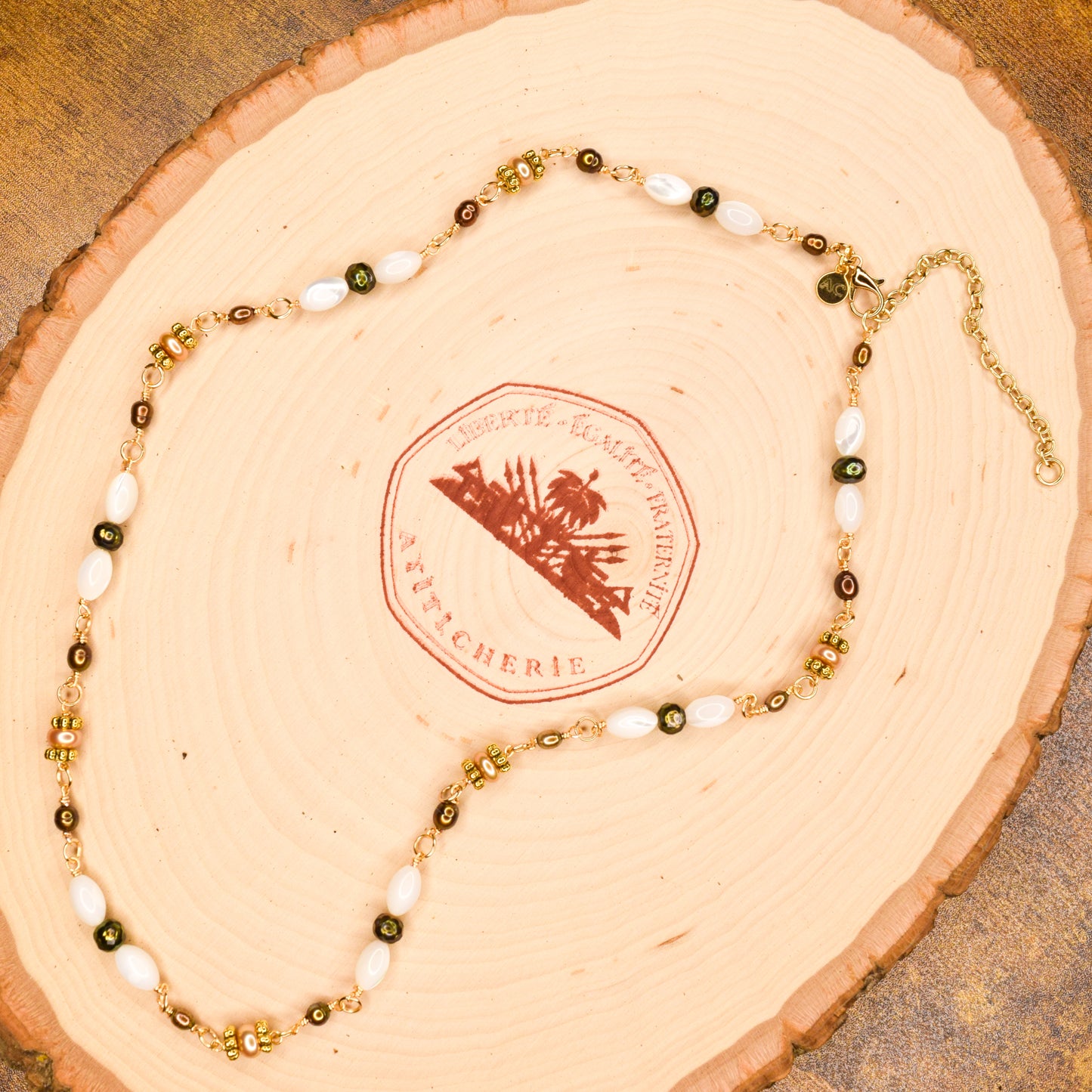 Handcrafted with mother-of-pearl, plated pyrite, and labradorite, for modern, refined elegance by Ayiti Chérie. Haitian-inspired, lifestyle brand