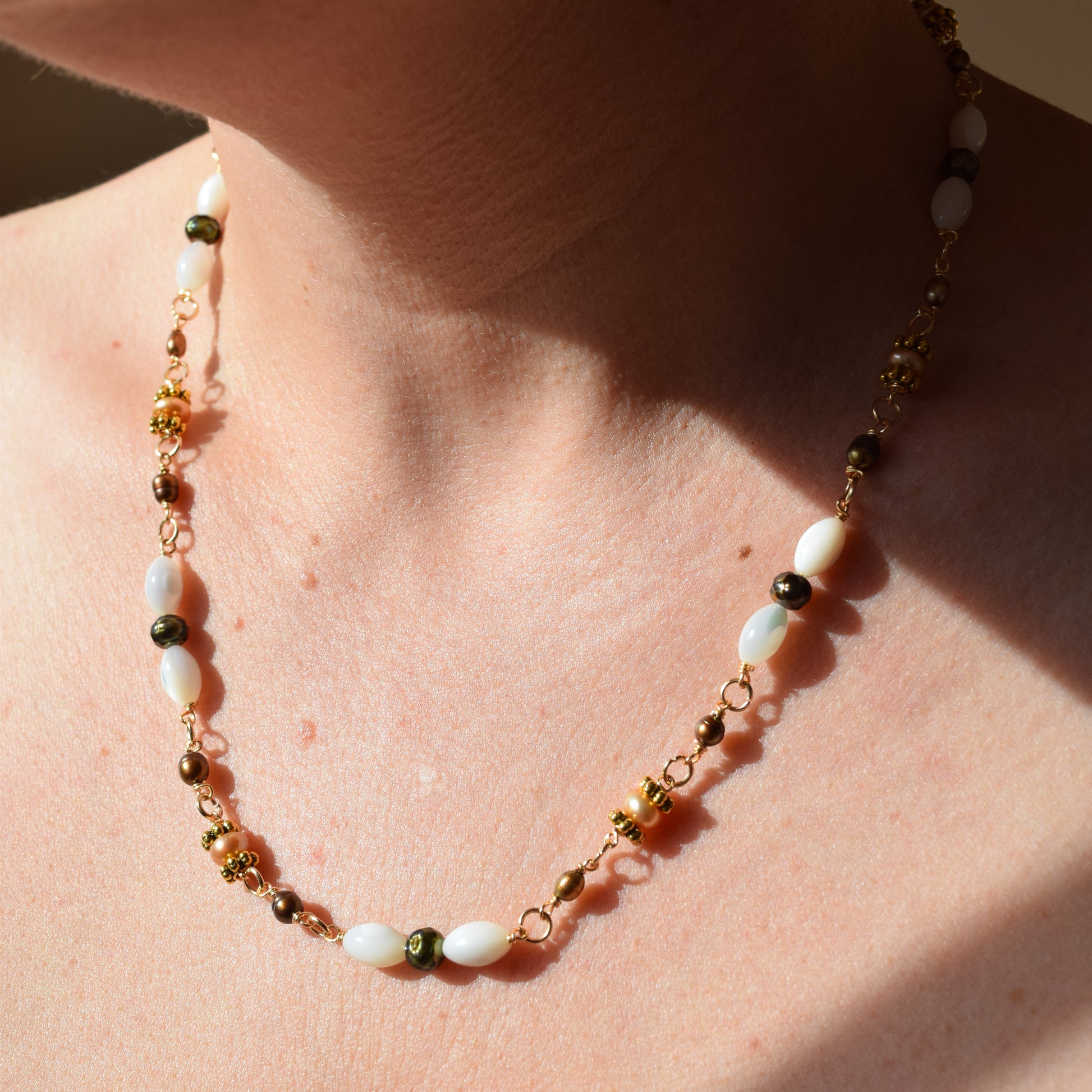 Handcrafted with mother-of-pearl, plated pyrite, and labradorite, for modern, refined elegance by Ayiti Chérie. Haitian-inspired, lifestyle brand