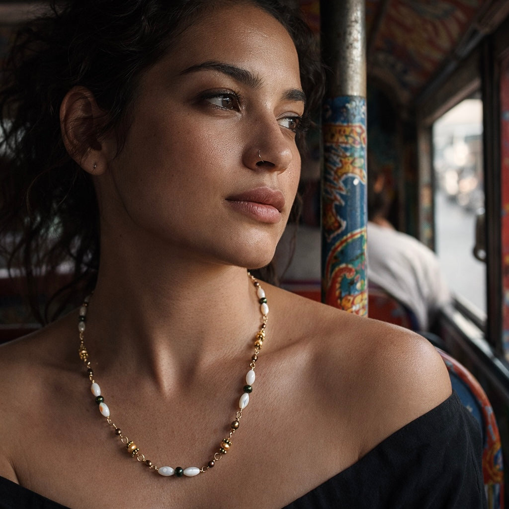 Handcrafted with mother-of-pearl, plated pyrite, and labradorite, for modern, refined elegance by Ayiti Chérie. Haitian-inspired, lifestyle brand