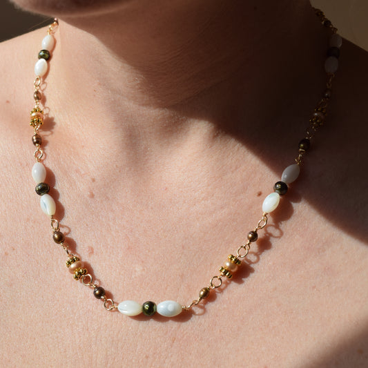 Handcrafted with mother-of-pearl, plated pyrite, and labradorite, for modern, refined elegance by Ayiti Chérie. Haitian-inspired, lifestyle brand