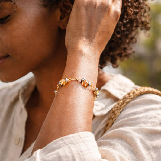 Handcrafted with 18K gold-plated paperclip chain, featuring citrine and hematite for elegant, refined style by Ayiti Chérie. Haitian-inspired, lifestyle brand