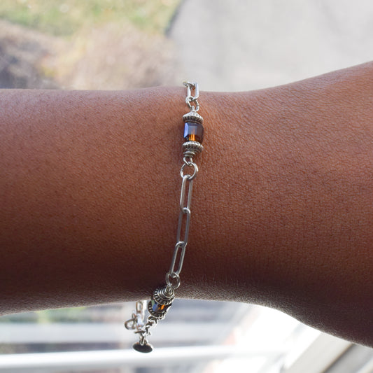 Handcrafted with paperclip chain featuring glass cube & bicone metal beads for elegant, refined style by Ayiti Chérie. Haitian-inspired, lifestyle brand