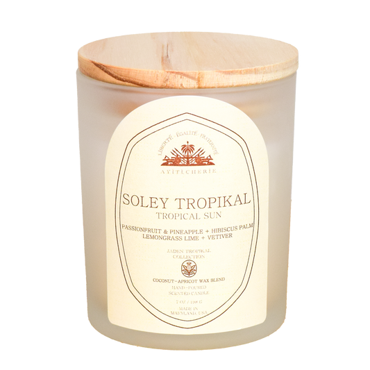 Haitian-inspired candle with passionfruit, pineapple, hibiscus palm, lemongrass lime, and vetiver by Ayiti Cherie 