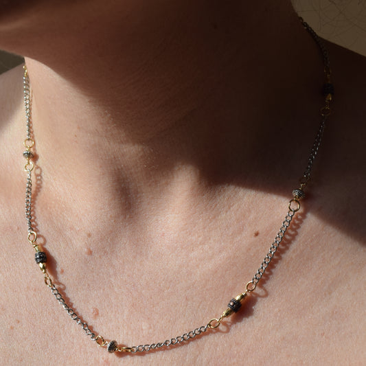 Handcrafted with delicate curb chain, featuring drum and bicone metal beads for elegant, refined style by Ayiti Chérie. Haitian-inspired, lifestyle brand