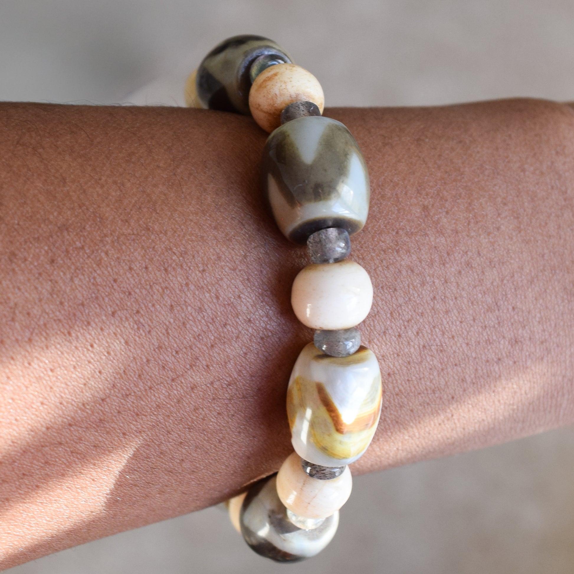 Handcrafted bracelet with agate, labradorite, and bone beads for elegant, refined style by Ayiti Chérie. Haitian-inspired, lifestyle brand