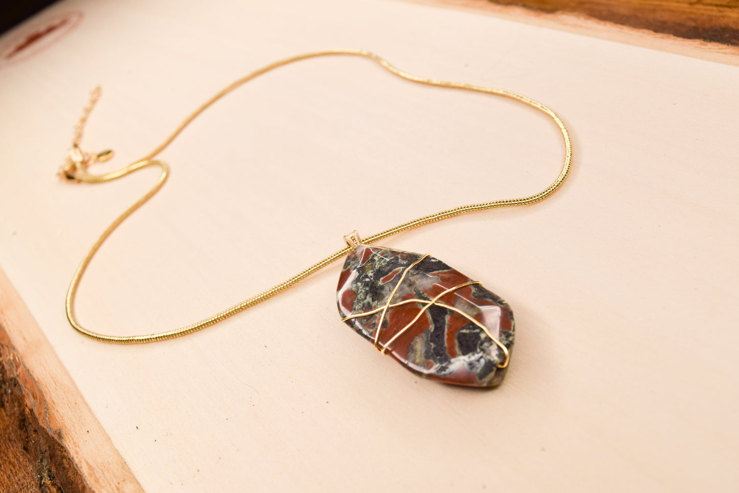 Handcrafted with a wire-wrapped snakeskin pendant for elegant, refined style by Ayiti Chérie. Haitian-inspired, lifestyle brand