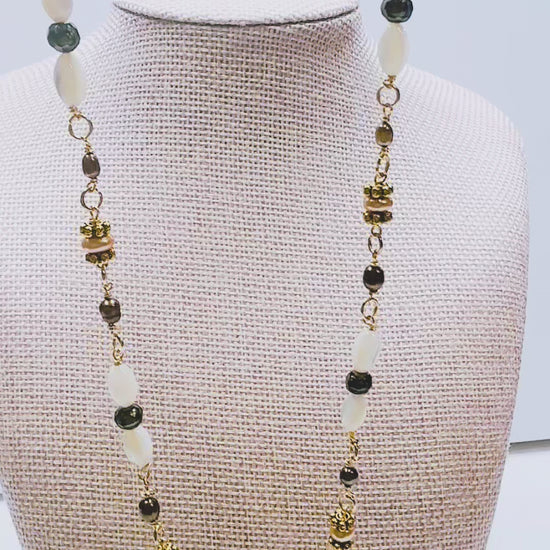 Handcrafted with mother-of-pearl, plated pyrite, and labradorite, for modern, refined elegance by Ayiti Chérie. Haitian-inspired, lifestyle brand