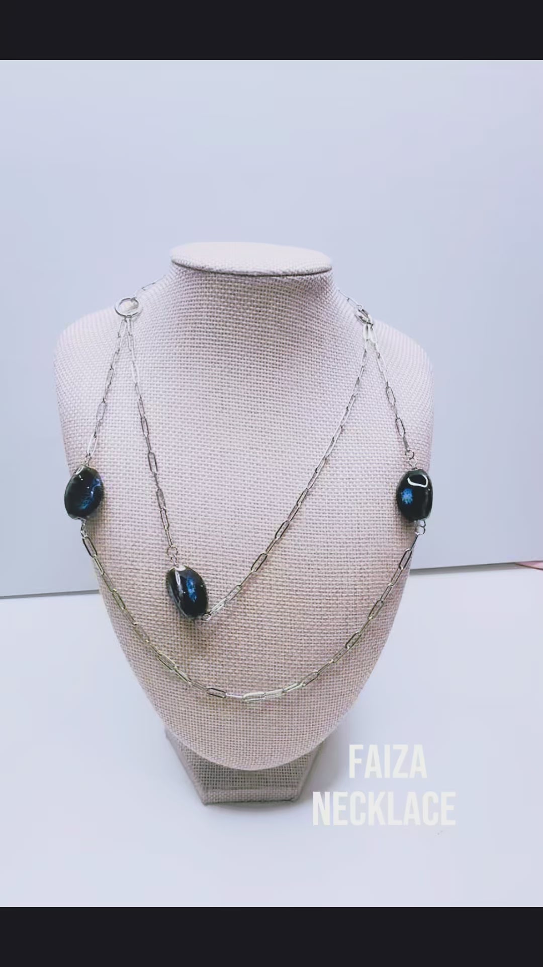 Handcrafted with silver paper-clip chain featuring twisted oval ceramic beads for elegant, refined style by Ayiti Chérie. Haitian-inspired, lifestyle brand
