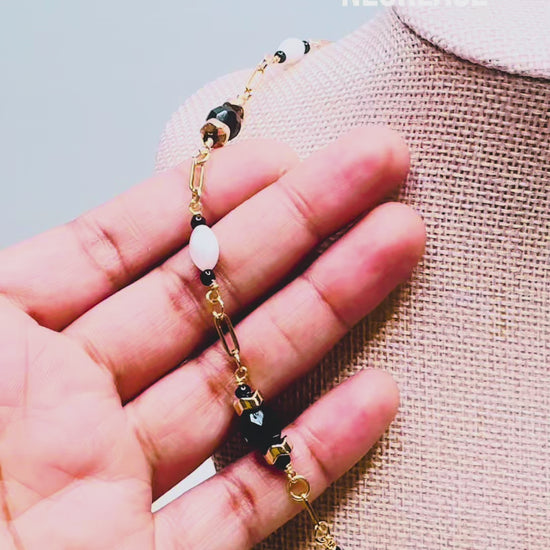 Handcrafted necklace- Mother-of-Pearl, hematite, & glass beads for refined, modern elegance. Haitian-inspired, lifestyle brand